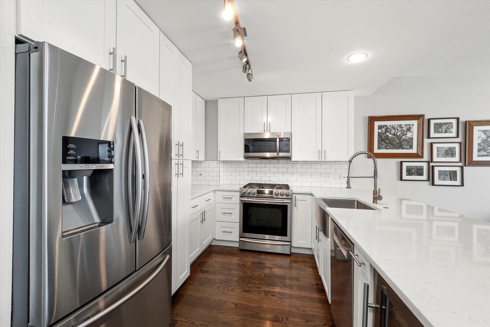 1515 South Prairie Avenue, Unit 910 Chicago, IL 60605 - Photo 5 of 32 a kitchen with stainless steel appliances a refrigerator sink and microwave