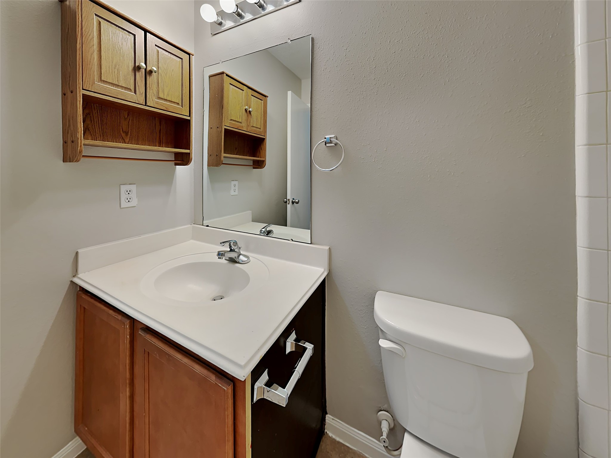 8119 Katie Mill Trail Spring, TX 77379 - Photo 8 of 18 a bathroom with a sink a toilet and mirror