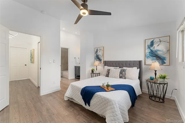 a bed room with a bed and a painting