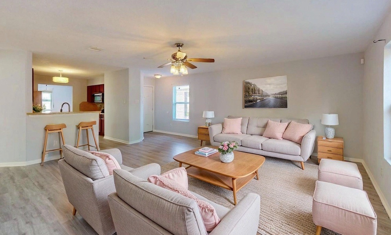 9877 Lace Flower Way Conroe, TX 77385 - Photo 7 of 43 a living room with furniture a wooden floor and a chandelier