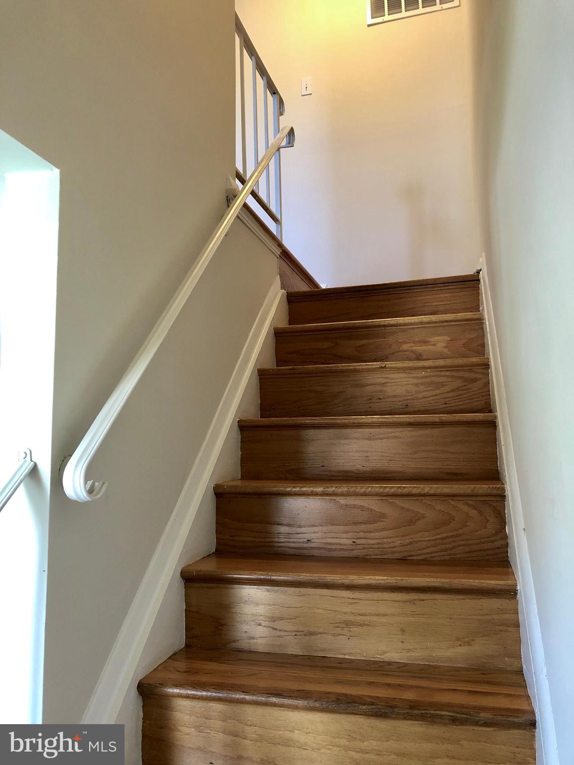 702 Kingston Road Baltimore, MD 21220 - Photo 16 of 30 Stairs to bedrooms