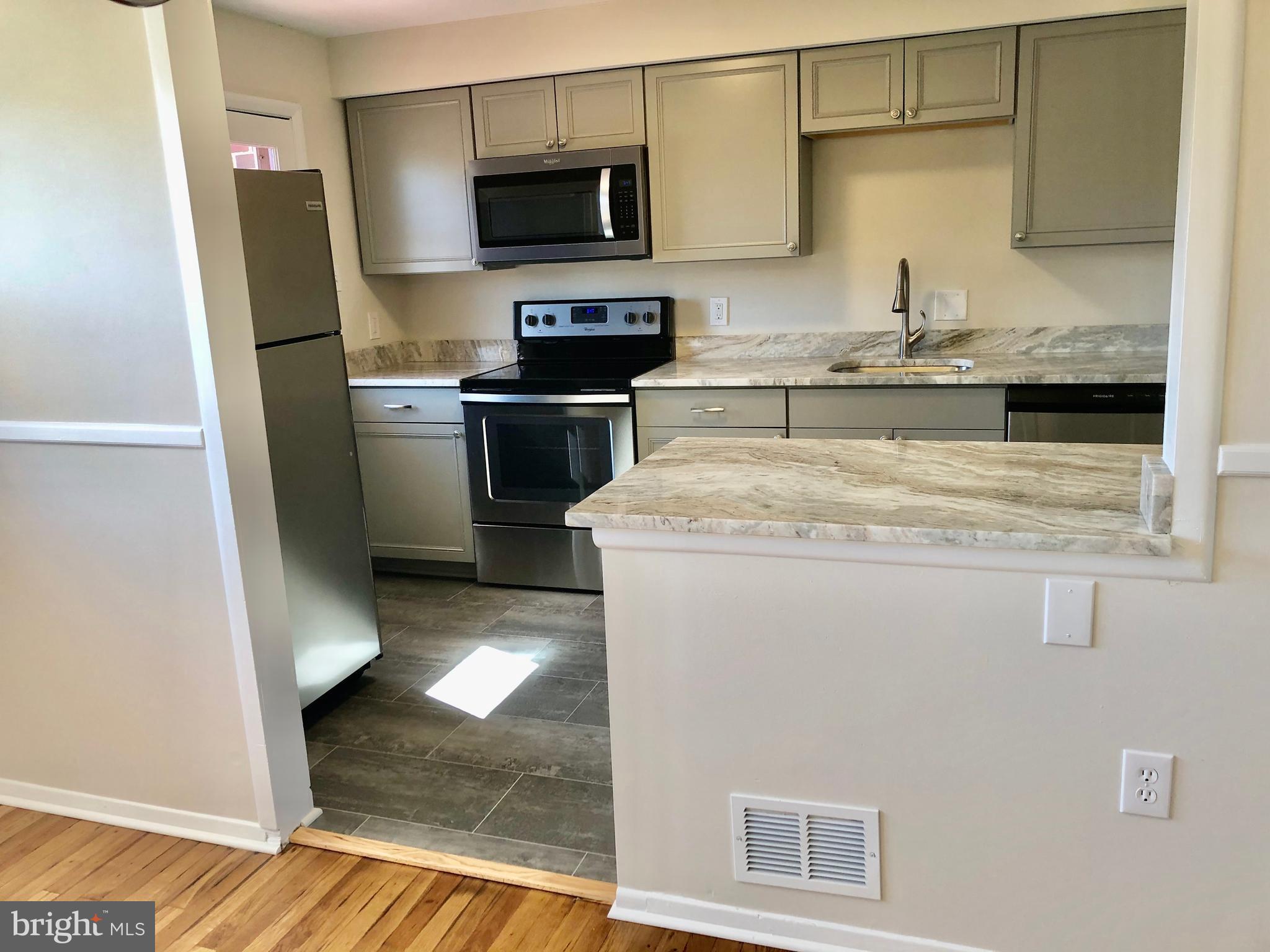 702 Kingston Road Baltimore, MD 21220 - Photo 7 of 30 New kitchen with granite countertops