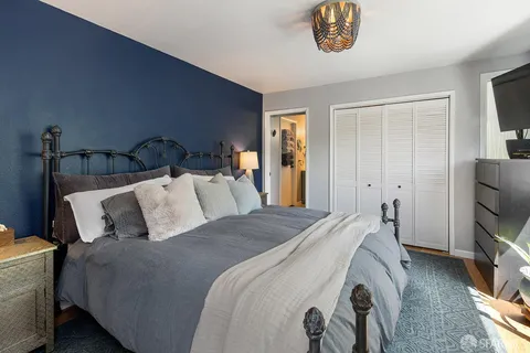 a bedroom with bed and a window