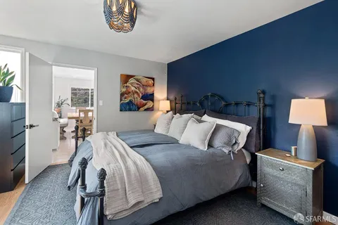 a bed room with a bed and a lamp