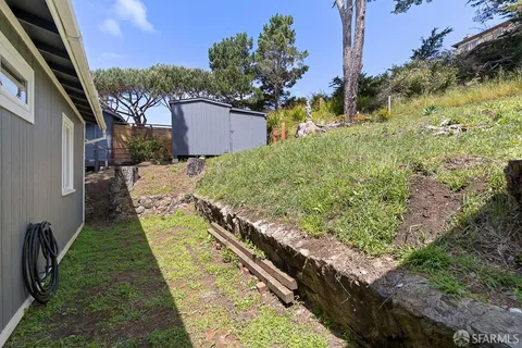 a backyard of a house with lots of green space