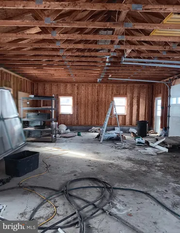 a view of livingroom with wooden floor and furniture