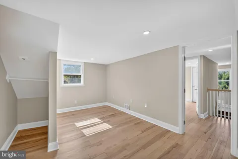 a view of livingroom with hardwood floor and a ceiling fan