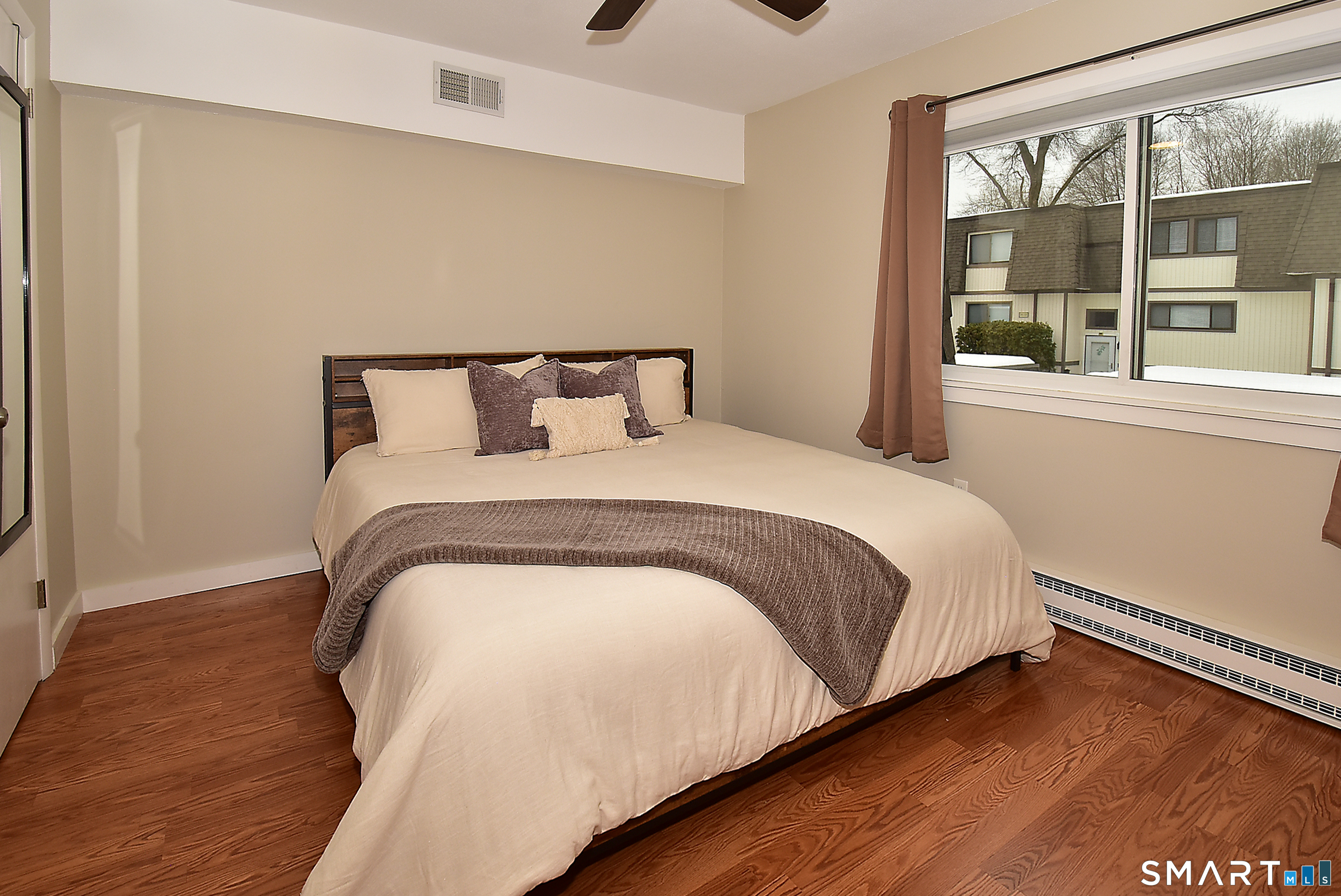 24 Pebblestone Circle, Unit 24 Suffield, CT 06078 - Photo 17 of 25 a large bed sitting in a bedroom next to a window