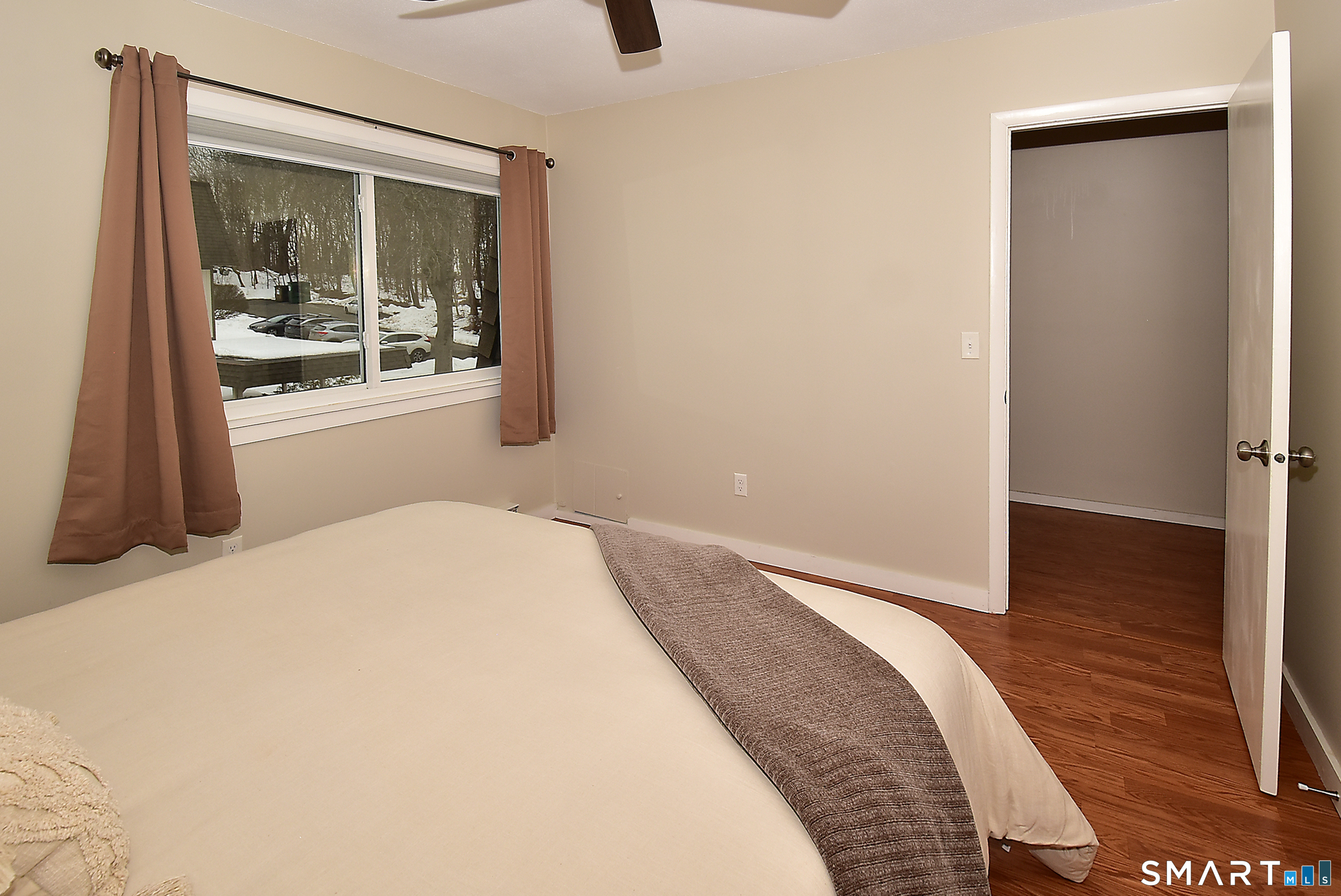 24 Pebblestone Circle, Unit 24 Suffield, CT 06078 - Photo 18 of 25 a bedroom with a bed and wooden floor