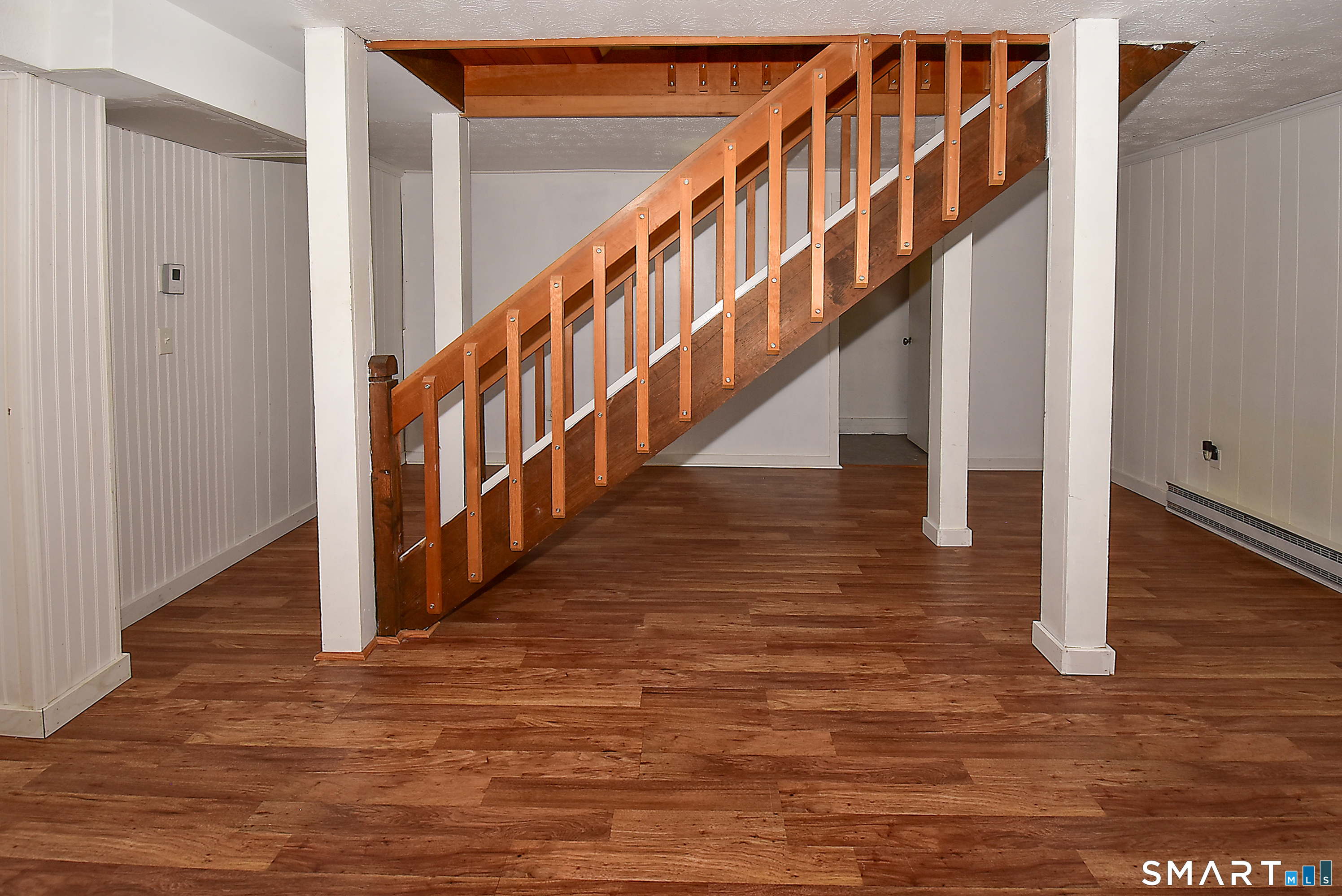 24 Pebblestone Circle, Unit 24 Suffield, CT 06078 - Photo 20 of 25 a view of staircase with wooden floor and white walls