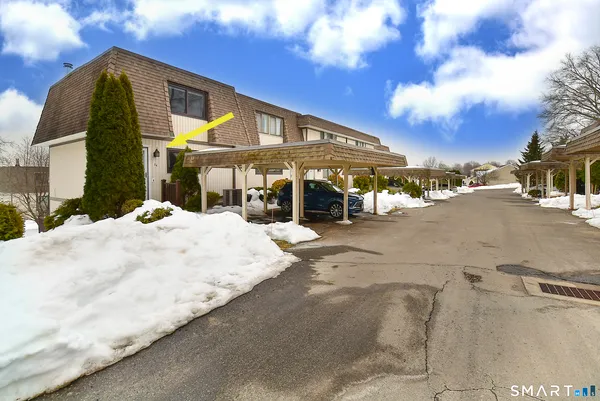 a view of a white house with a yard