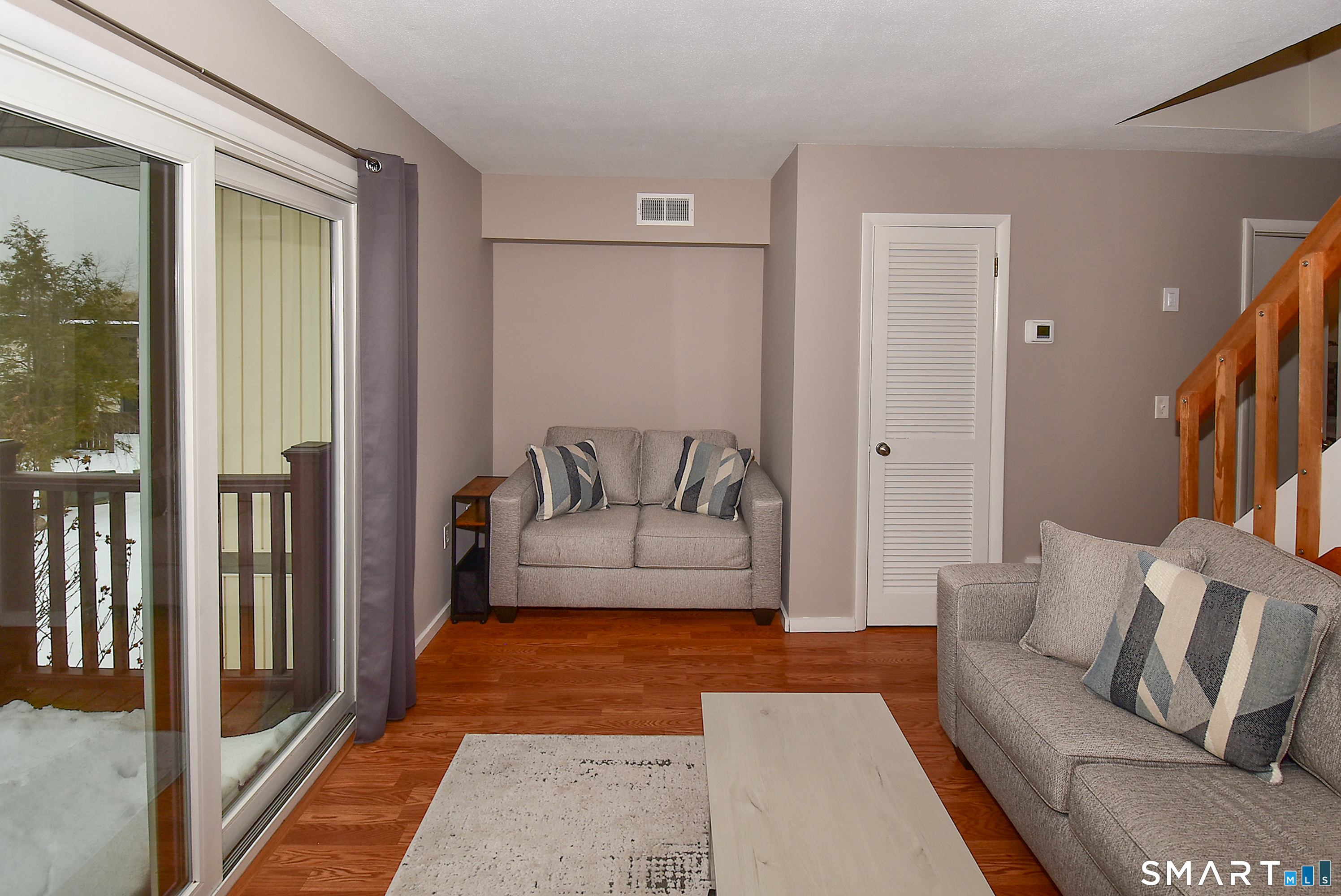 24 Pebblestone Circle, Unit 24 Suffield, CT 06078 - Photo 5 of 25 a living room with furniture and a rug