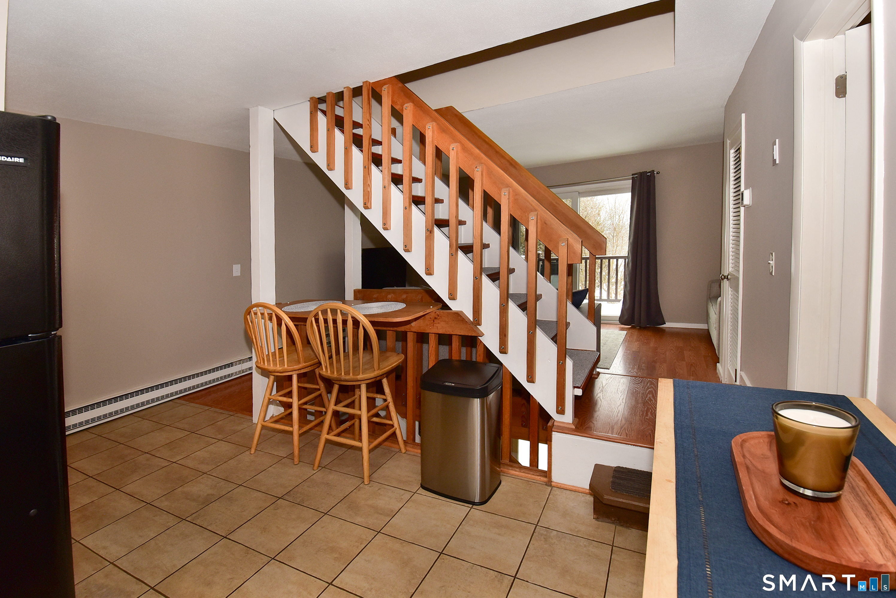 24 Pebblestone Circle, Unit 24 Suffield, CT 06078 - Photo 8 of 25 a dining room with furniture and wooden floor