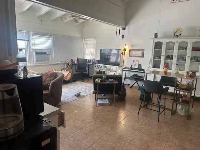 a living room with lots of furniture and a window