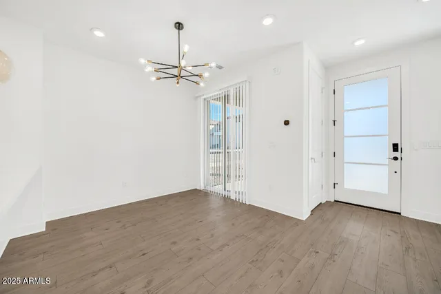 a kitchen with stainless steel appliances kitchen island granite countertop a stove a sink and a microwave