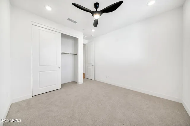 a view of a balcony with wooden floor