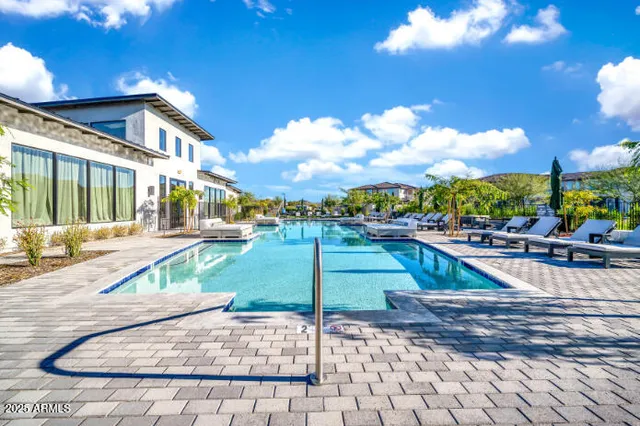 a view of a kitchen with a sink dishwasher a refrigerator and cabinets