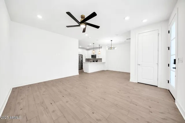a kitchen with granite countertop a sink stainless steel appliances and cabinets