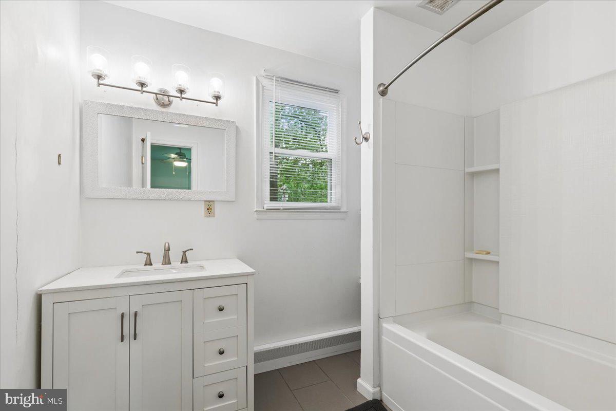 319 Gambrills Road Gambrills, MD 21054 - Photo 19 of 35 a bathroom with a tub a sink and mirror