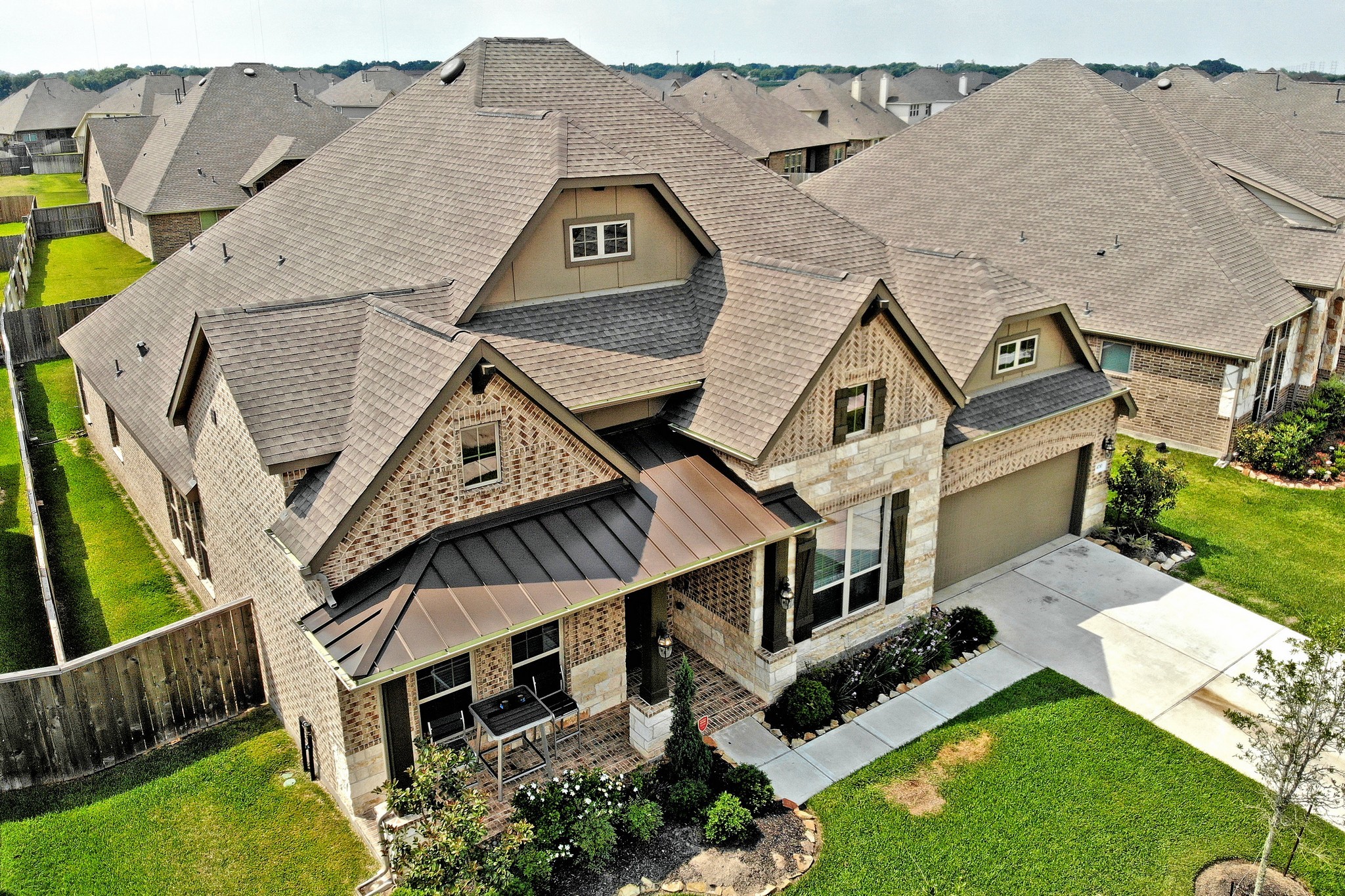 an aerial view of a house with a big yard
