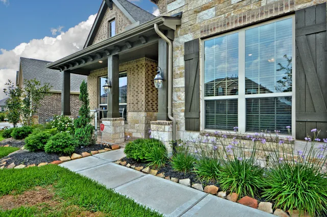 front view of a house with a small yard