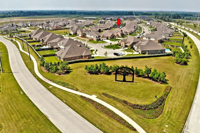a view of a swimming pool and an outdoor seating