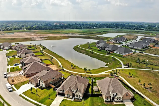 an aerial view of a house with a ocean view