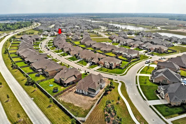 an aerial view of a house with a swimming pool