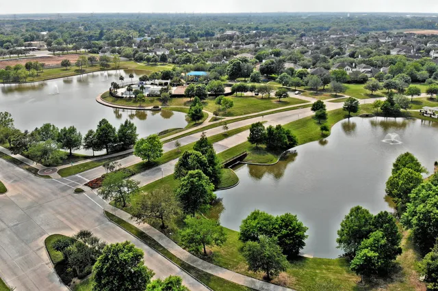 an aerial view of a city with lake view