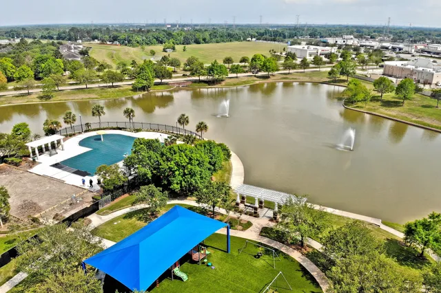 an aerial view of a house with a lake view