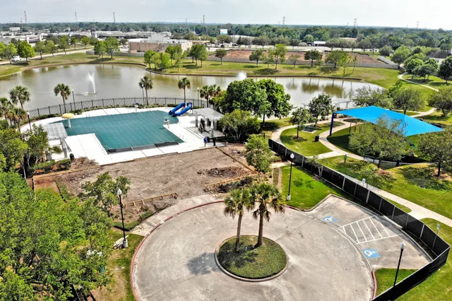 a view of a lake with a house swimming pool and outdoor space