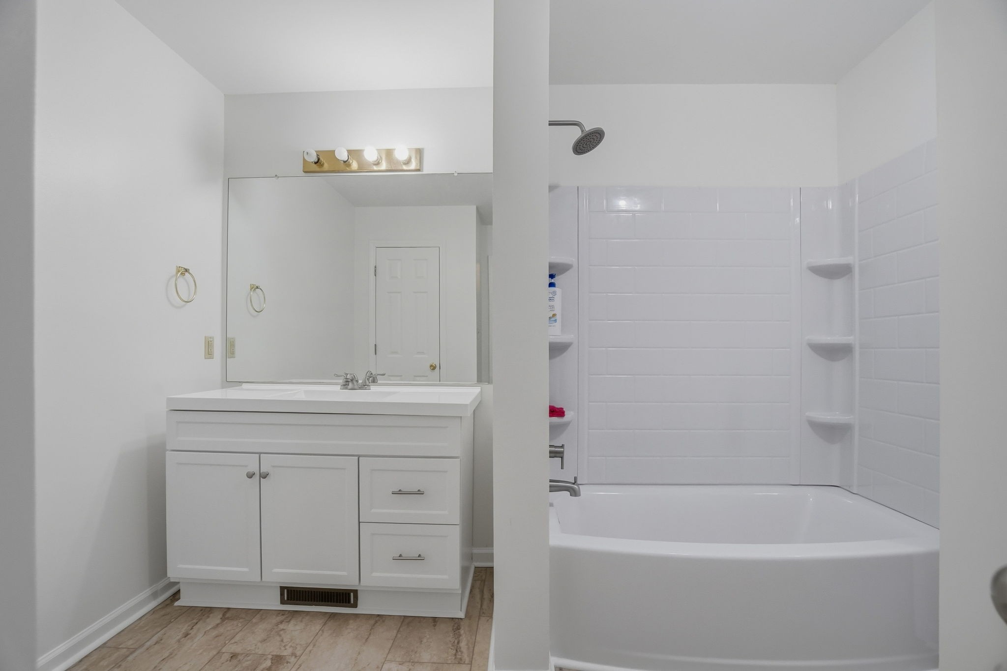230 Woodruff Road Adams, TN 37010 - Photo 18 of 36 a bathroom with a tub sink and mirror