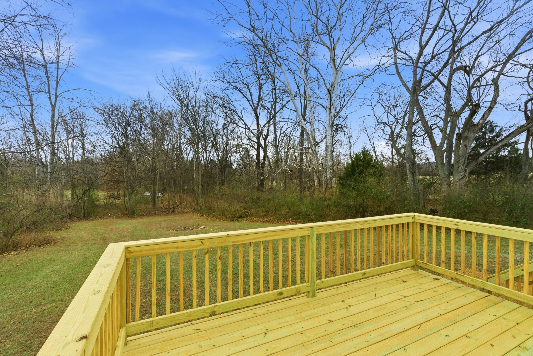 230 Woodruff Road Adams, TN 37010 - Photo 28 of 36 a view of a wooden deck