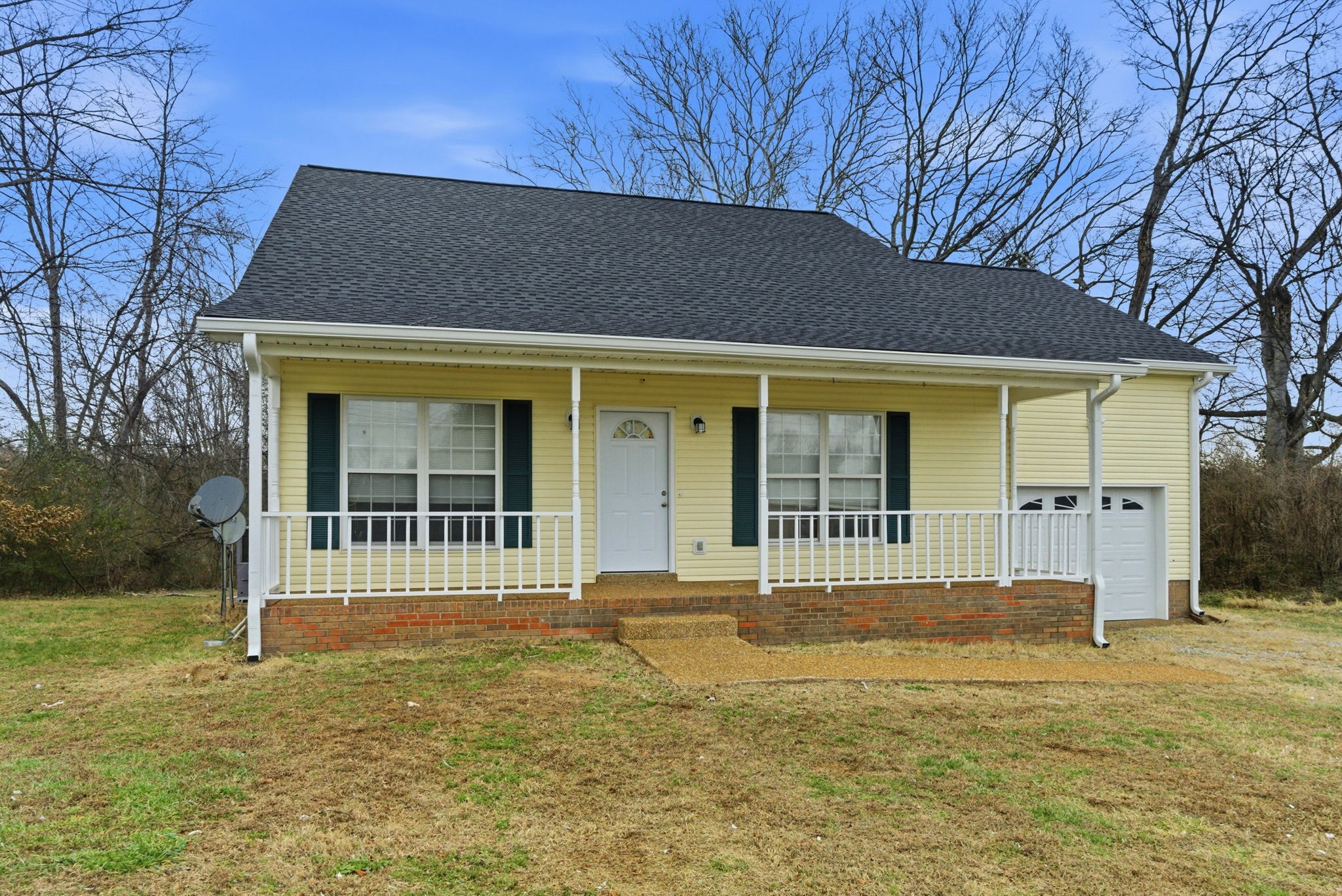230 Woodruff Road Adams, TN 37010 - Photo 4 of 36 front view of a house with a yard