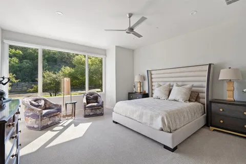 a living room with furniture and a book shelf