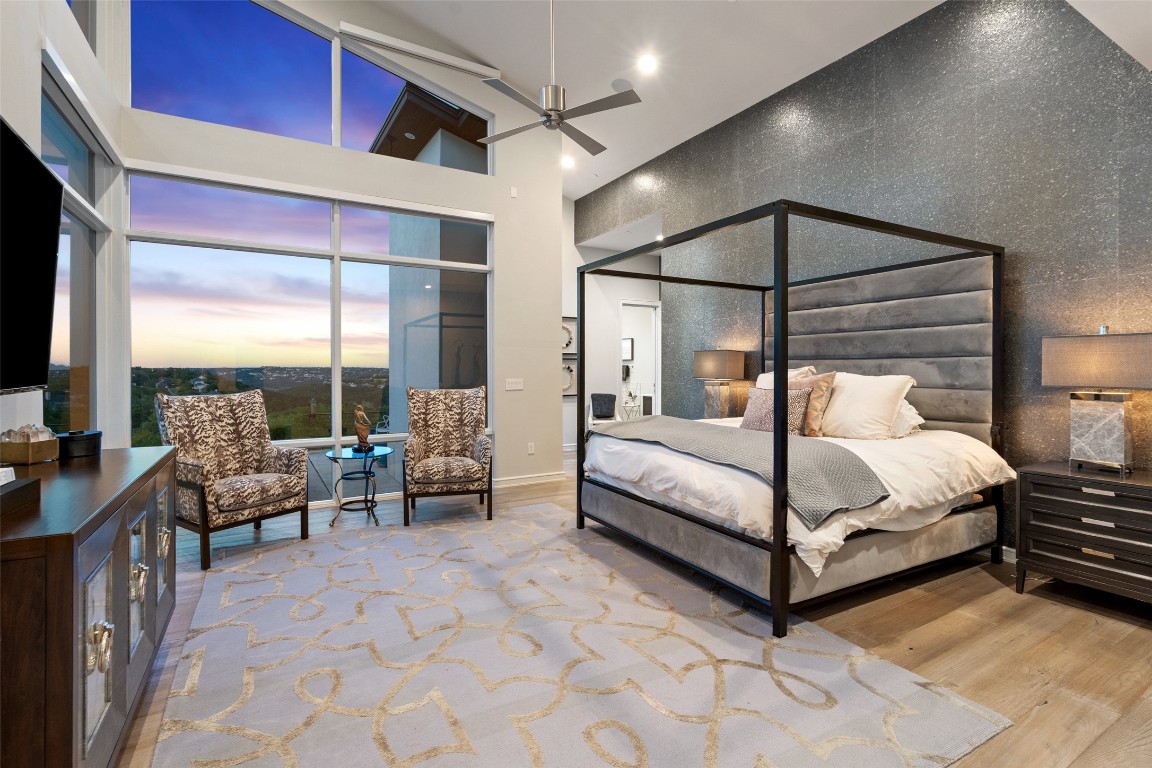 2551 Waymaker Way Austin, TX 78746 - Photo 31 of 36 a bedroom with a bed and large window