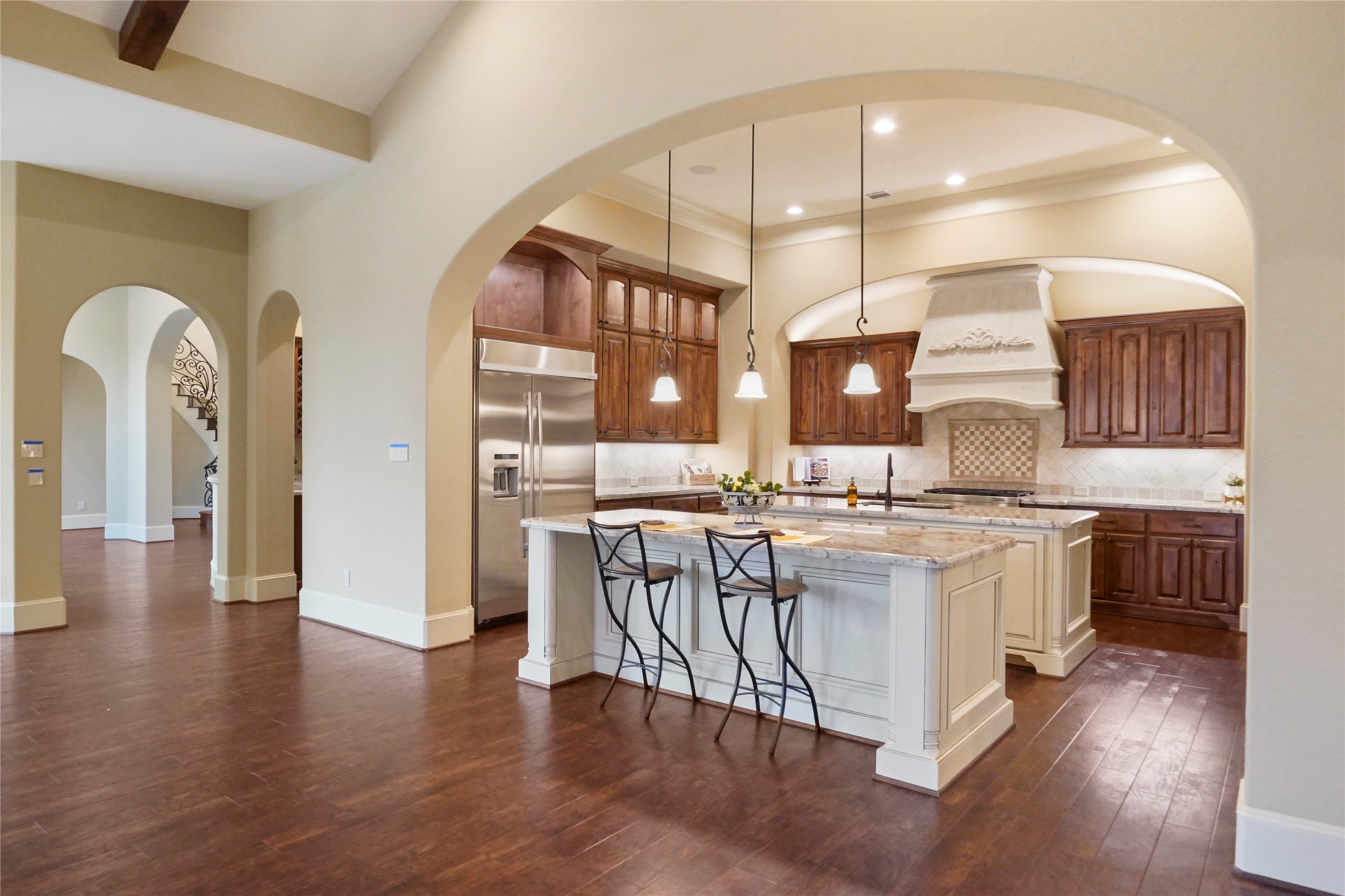 18 Rugged Lark Circle Tomball, TX 77377 - Photo 50 of 50 Open floor plan flows from the entry to Breakfast Room-Kitchen-Den/Family Room. All the areas overlook the Outdoor Entertainment Area.