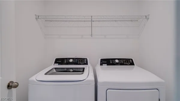 a utility room with dryer and washer