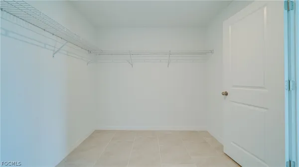 a bathroom with double sink and a mirror