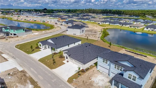 an aerial view of a house with a swimming pool