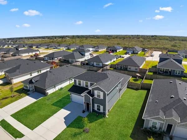 an aerial view of a house with a garden