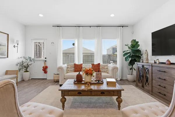 a view of a dining room with furniture and wooden floor