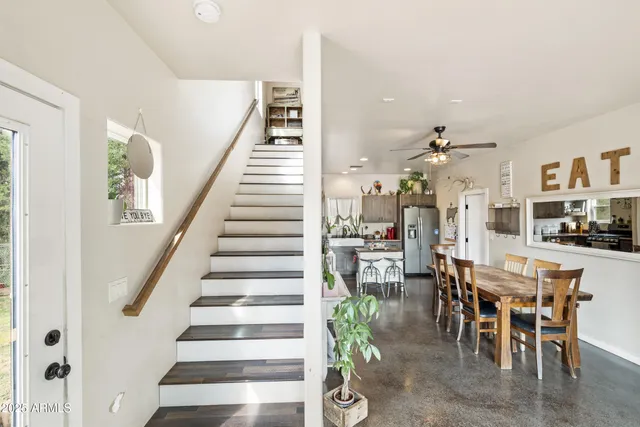 a view of entryway with wooden floor and stairs
