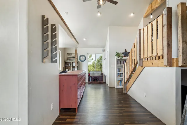 a very nice looking room with wooden floor and a window