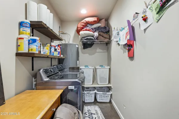 a bedroom with furniture and flat screen tv