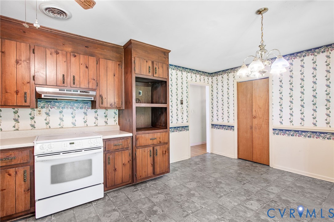 3513 Union Branch Road Petersburg, VA 23805 - Photo 15 of 32 a kitchen with stainless steel appliances granite countertop a refrigerator sink and cabinets