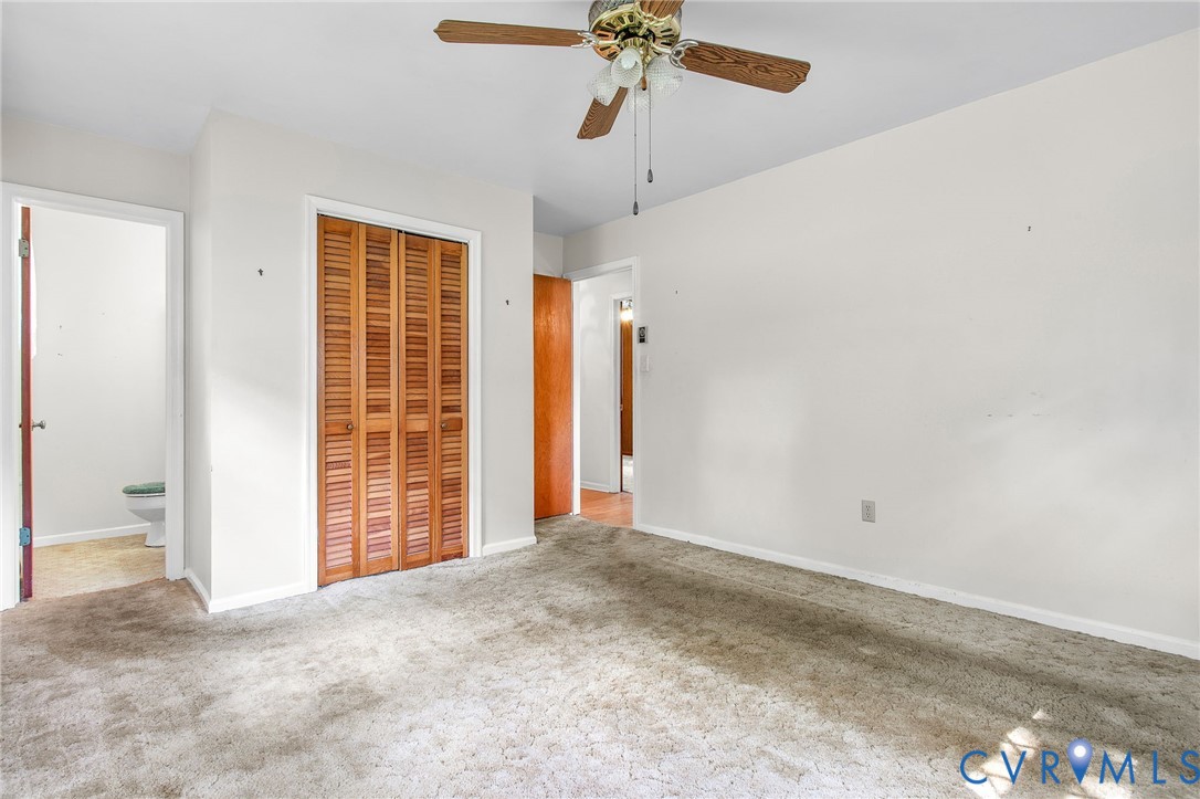 3513 Union Branch Road Petersburg, VA 23805 - Photo 21 of 32 an empty room with fan and windows