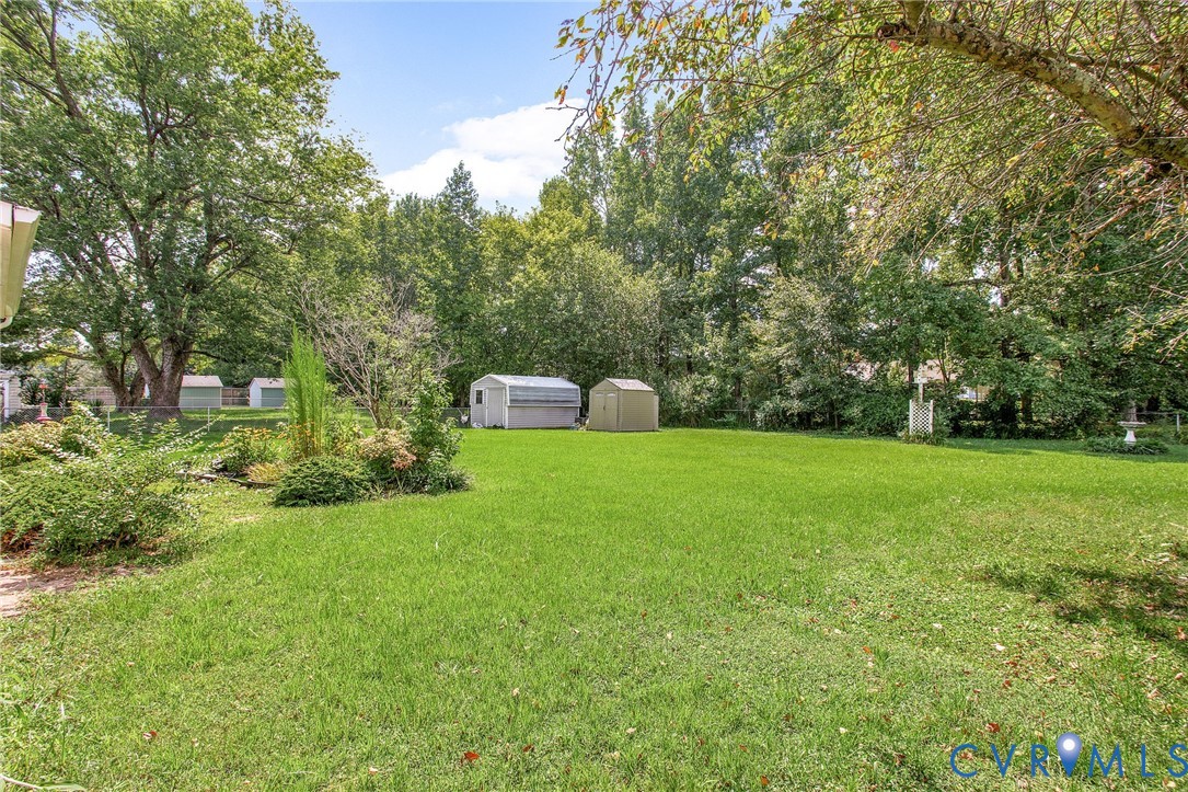3513 Union Branch Road Petersburg, VA 23805 - Photo 27 of 32 a front view of a house with garden and trees
