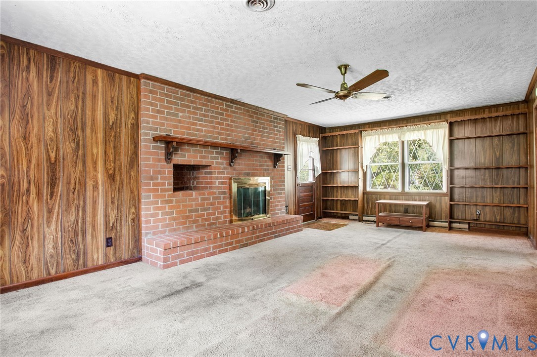 3513 Union Branch Road Petersburg, VA 23805 - Photo 10 of 32 a view of a livingroom with a large window and chandelier fan