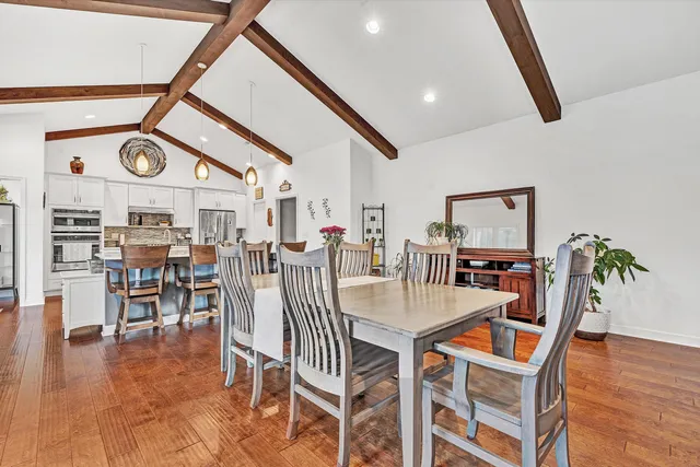 a view of a dining room with furniture window and wooden floor